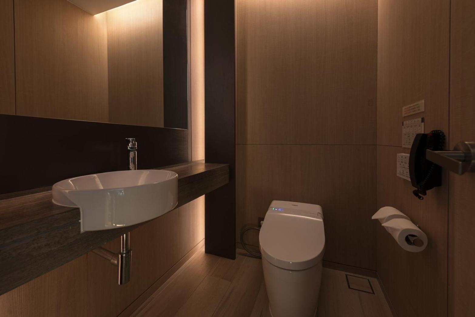 Mu Jiaoxi Hotel Exterior photo A modern bathroom